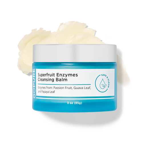 Open jar of GoPure Superfruit Enzymes Cleansing Balm with a creamy texture visible, labeled with ingredients like passion fruit, guava leaf, and papaya leaf in a 3 oz container.