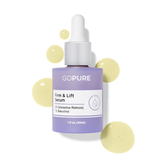 Purple bottle of GoPure Firm & Lift Serum with visible serum droplets, containing 2% Granactive Retinoid and 1% Bakuchiol. 1 fl oz