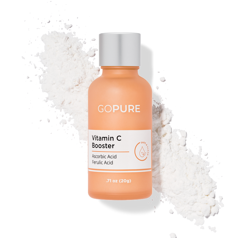 Peach-hued bottle of GoPure Vitamin C Booster next to a white powder scatter, highlighting Ascorbic Acid and Ferulic Acid, .71 oz (20g).