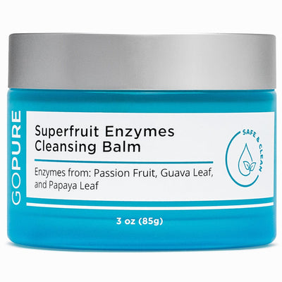 Blue jar of GoPure's Superfruit Enzymes Cleansing Balm containing ingredients like passion fruit, guava leaf, and papaya leaf. 3 oz.